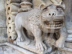 lion sculpture guarding over the entrance of a chapel