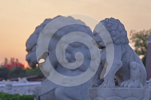 Lion sculptures in the sunset. Tiananmen Square, Beijing, China.