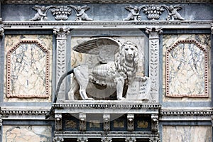 Lion of St. Mark on the facade of the Scuola Grande di San Marco photo