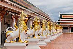 Lion statue in Asian style at phathat Cheung choom woravihan tem