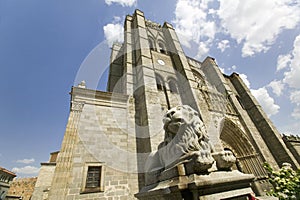 Lion statue in front of Catedral de Ã¯Â¿Â½vila Ã¯Â¿Â½ Ã¯Â¿Â½vila Cathedra, Cathedral of Avila, the oldest Gothic church in Spain in the old photo