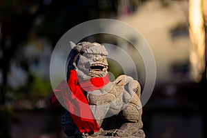 Lion statue in front of chinese temple on blurred background, Chinese New Year concept