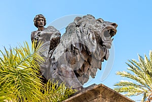 Lion statue in front of the Theater Massimo Vittorio Emanuele in Palermo, Italy.