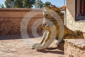 Lion statue guarding the entrance of a temple