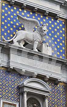 Lion statue in Piazza San Marck on blue sky background, Venice, Italy. This place is a tourist attraction of the city of Venice.