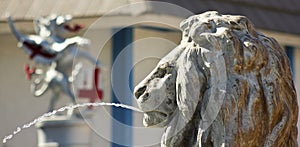 A Lion Statue Shoots an Arc of Water