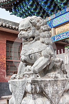 Lion Statue at Shuanglin Temple in Pingyao, Shanxi, China. It is part of UNESCO World Heritage Site - Ancient City of Ping Yao.