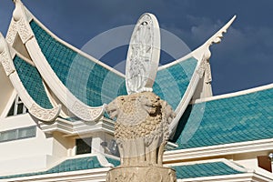 Lion statue and wheel of the law in front of buddhist church