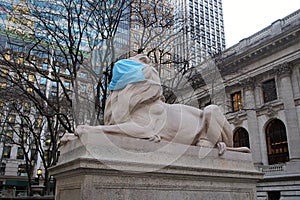 Lion wearing face mask, sculpture at the steps of New York Public Library, New York, NY