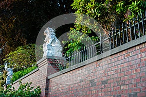 Lions on red brick wall