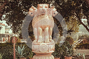 Lions on sculptured national emblem of India. Copy of the ancient Ashoka Pillar of Sarnath