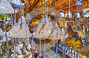 Lions and serpents on Burmese gongs, Htilominlo Temple market, Bagan, Myanmar