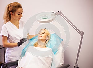 Lip Augmentation In Cosmetology Clinic. Beautiful Woman Getting Beauty Injection For Lips.