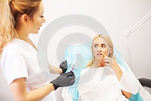 Lip Augmentation In Cosmetology Clinic. Beautiful Woman Getting Beauty Injection For Lips.