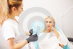 Lip Augmentation In Cosmetology Clinic. Beautiful Woman Getting Beauty Injection For Lips