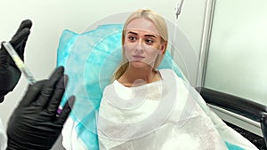 Lip Augmentation In Cosmetology Clinic. Beautiful Woman Getting Beauty Injection For Lips