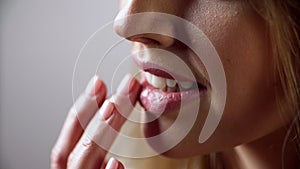 Lip Care. Woman Touching Soft Lips With Fingers Closeup