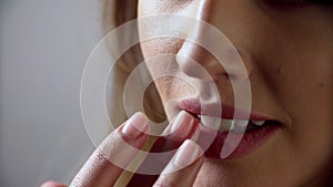 Lip care. Woman touching soft lips with fingers closeup