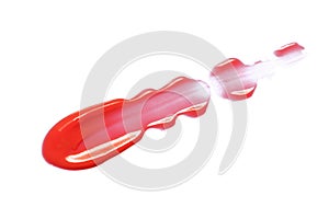 Lip gloss smear smudge swatch isolated on white background. Red lipstick, lip balm texture
