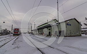 Lipany station in winter snow morning with trains and platforms