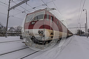 Lipany station in winter snow morning with trains and platforms