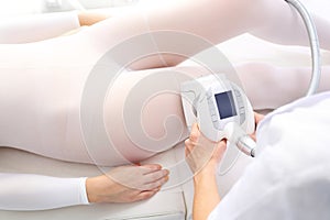 Lipomassage, lymphatic drainage. Endermologie treatment performed in a beauty salon