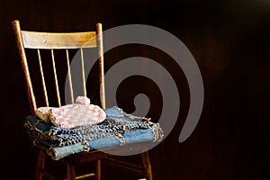 Slippers and Quilt folded neatly on Grandma`s Chair