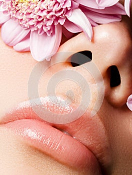 Lips augmentation. Perfect natural lip makeup. Close up macro photo with beautiful female mouth. Plump full lips. Close