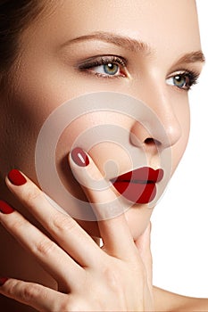 lips. Beauty red lips makeup detail. Beautiful make-up clos