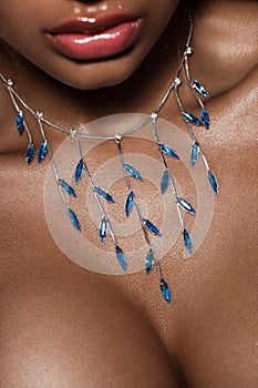 Lips with blue jewelry