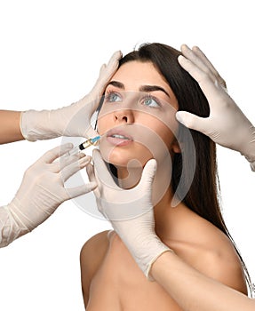 Plastic surgery beauty concept young brunette woman face and doctor hand in glove with syringe