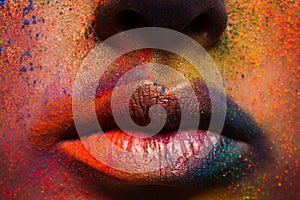 Lips of model with colorful art make-up, holi colors