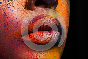 Lips of model with colorful art make-up, holi colors
