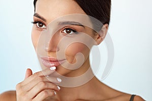 Lips Skin Care. Woman With Beauty Face Applying Lip Balm On