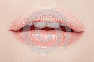 Lips, woman mouth beauty closeup in natural pink color