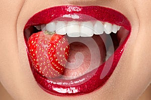 Lips. Woman With Red Lipstick And Strawberry