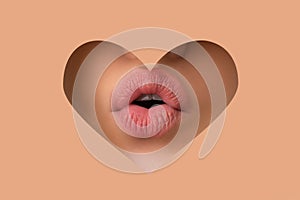 Lipscare. Nude Lip Makeup. Woman lip through hole in paper. Copy Space. Make-up and cosmetics.