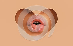 Lipscare. Nude Lip Makeup. Woman lip through hole in paper. Copy Space. Make-up and cosmetics.