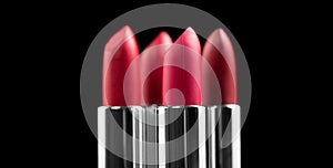 Lipstick. Fashion red Colorful Lipsticks isolated on black background. Red Matte lipstick tints palette