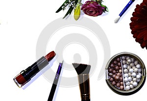 Lipstick and makeup brushes photo