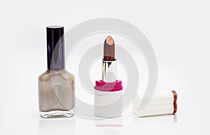 Lipstick with Nail Polish - makeup kit on white background