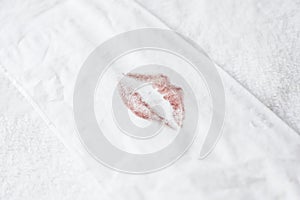 a lipstick print on a paper wipes. photo