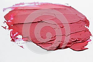 Lipstick smear smudge swatch isolated on white background. Cream makeup texture. Bright red color cosmetic product brush stroke sw