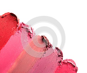 Lipstick smears isolated on white, top view.