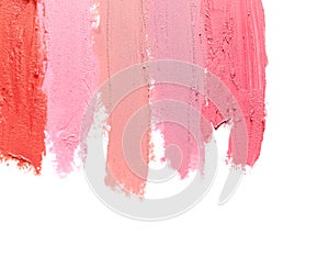 Lipstick smears isolated on white, top view.