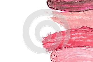 Lipstick smears isolated on white, top view.