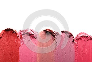 Lipstick smears isolated on white, top view.