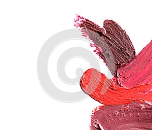 Lipstick smears isolated on white, top view.