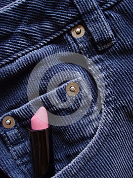 Lipstick tucked in pocket of jeans photo