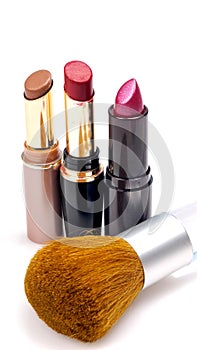 Lipsticks and brush photo